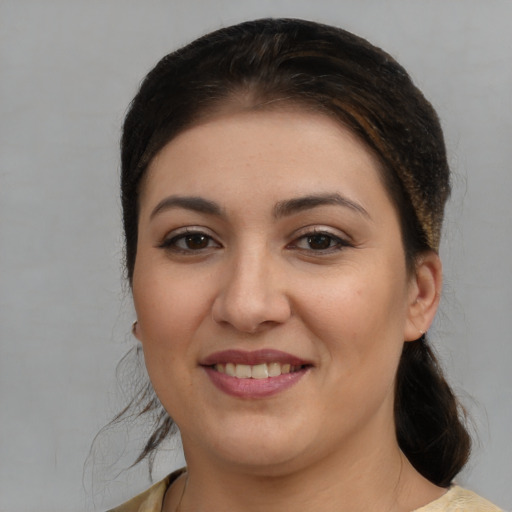Joyful white young-adult female with medium  brown hair and brown eyes