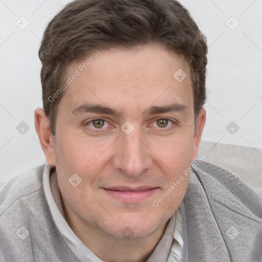 Joyful white adult male with short  brown hair and grey eyes