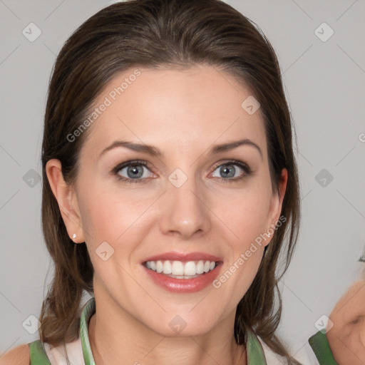 Joyful white young-adult female with medium  brown hair and blue eyes