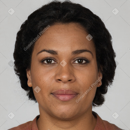 Joyful black adult female with medium  brown hair and brown eyes