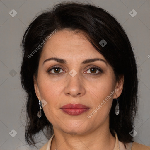 Joyful white adult female with medium  brown hair and brown eyes