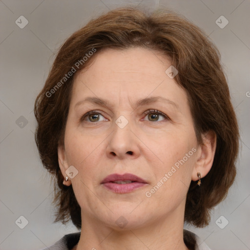 Joyful white adult female with medium  brown hair and grey eyes