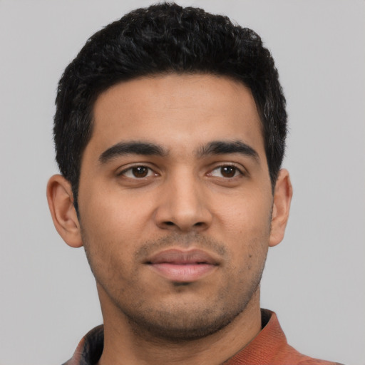 Neutral latino young-adult male with short  black hair and brown eyes