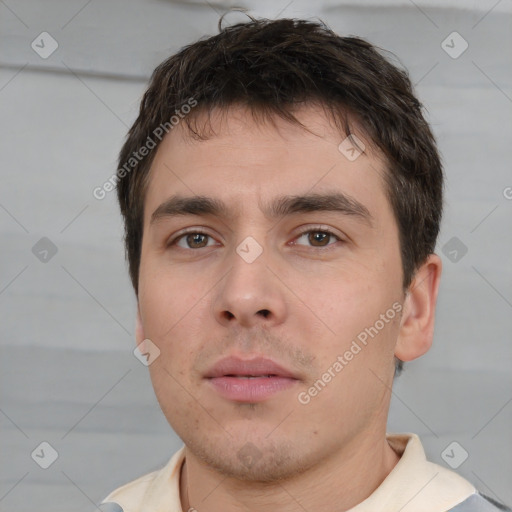 Neutral white young-adult male with short  brown hair and brown eyes