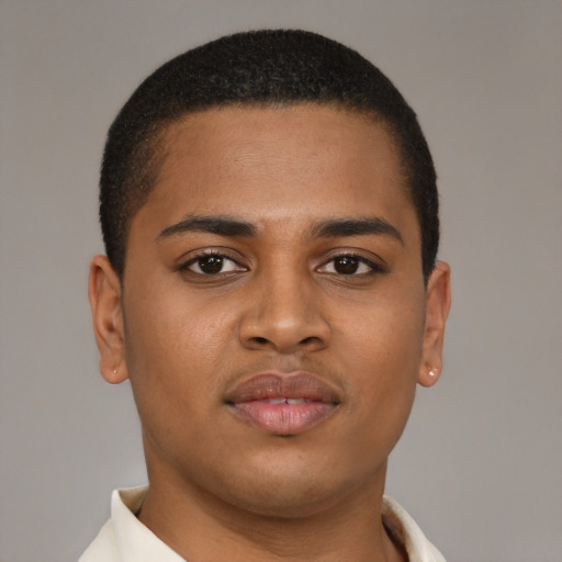 Joyful latino young-adult male with short  brown hair and brown eyes