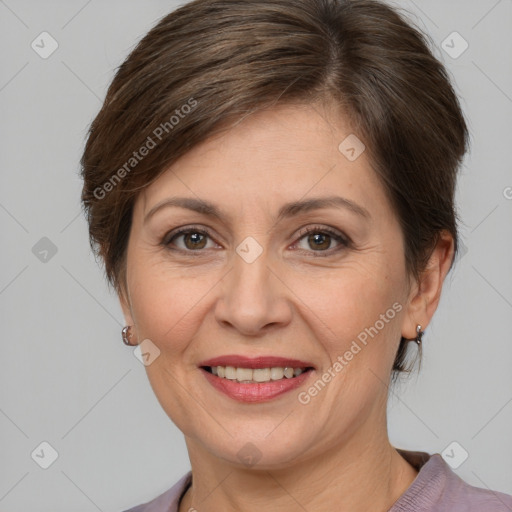 Joyful white adult female with medium  brown hair and grey eyes