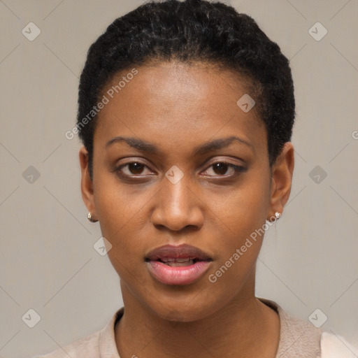 Joyful black young-adult female with short  black hair and brown eyes