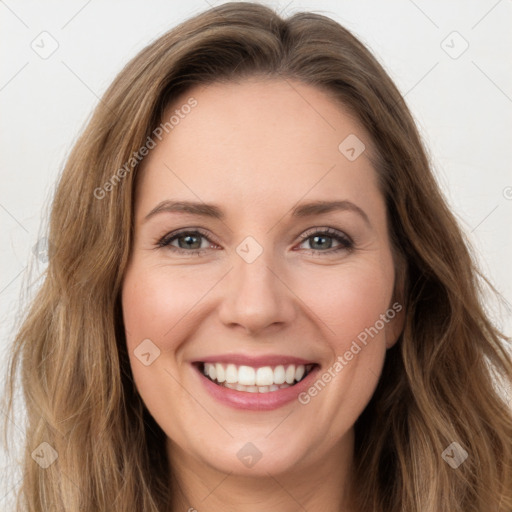 Joyful white young-adult female with long  brown hair and green eyes