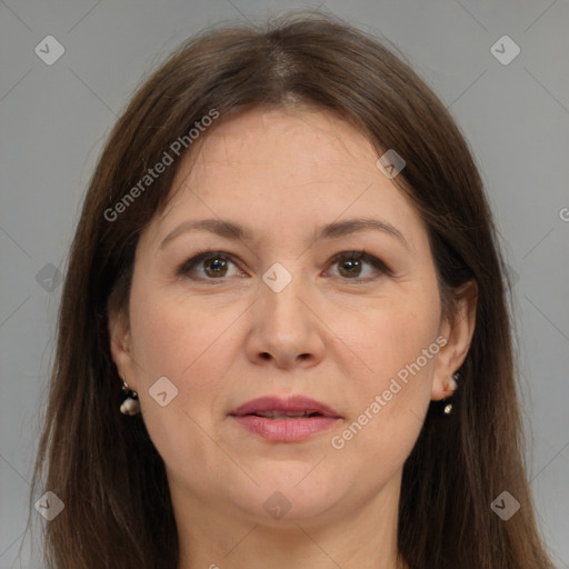 Joyful white adult female with long  brown hair and brown eyes