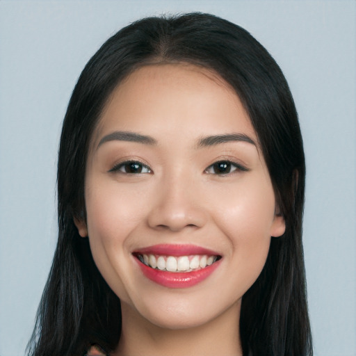 Joyful white young-adult female with long  black hair and brown eyes