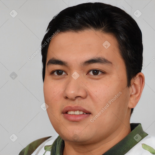 Joyful asian young-adult male with short  black hair and brown eyes