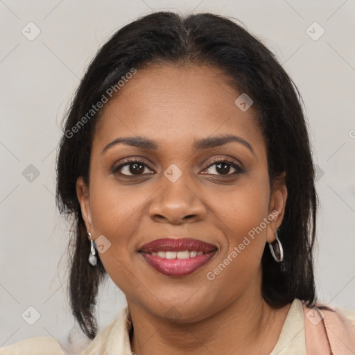 Joyful black young-adult female with medium  brown hair and brown eyes