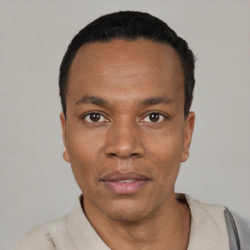 Neutral black young-adult male with short  black hair and brown eyes