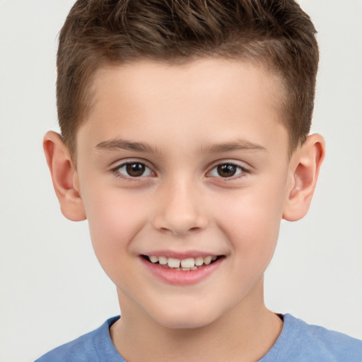 Joyful white child male with short  brown hair and brown eyes