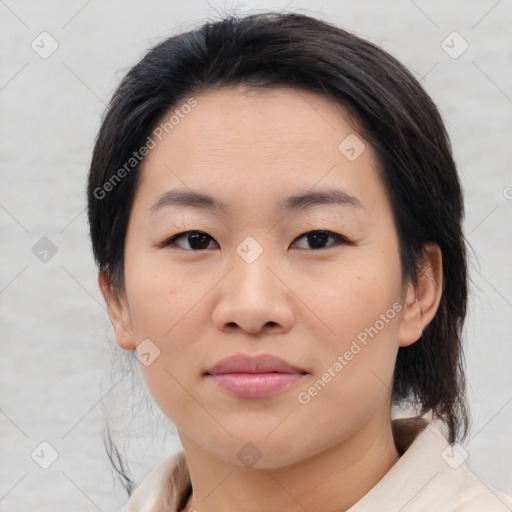 Joyful asian young-adult female with medium  black hair and brown eyes