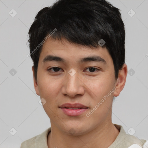 Joyful asian young-adult male with short  black hair and brown eyes