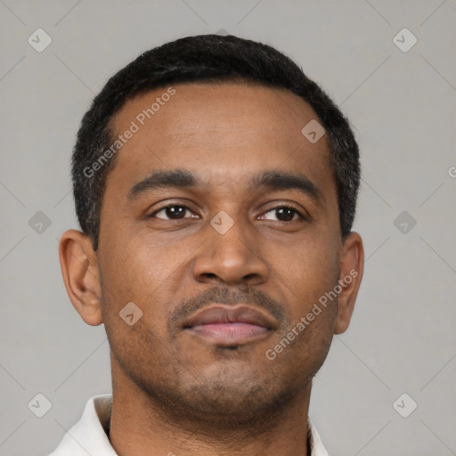 Neutral latino young-adult male with short  black hair and brown eyes