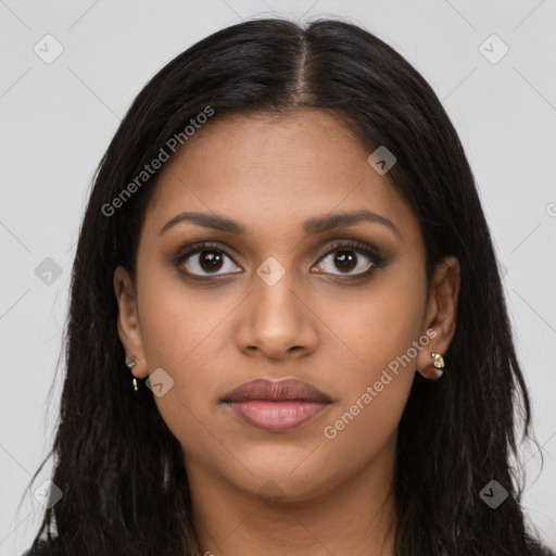 Joyful latino young-adult female with long  brown hair and brown eyes