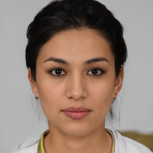Joyful latino young-adult female with medium  black hair and brown eyes