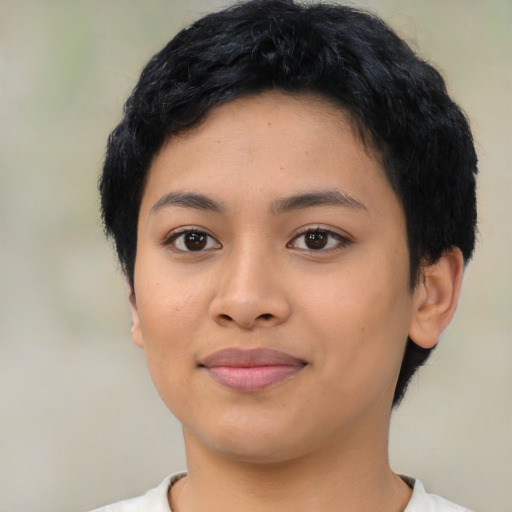 Joyful latino young-adult female with short  black hair and brown eyes