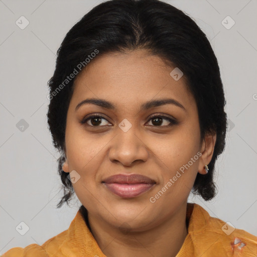 Joyful black young-adult female with long  brown hair and brown eyes