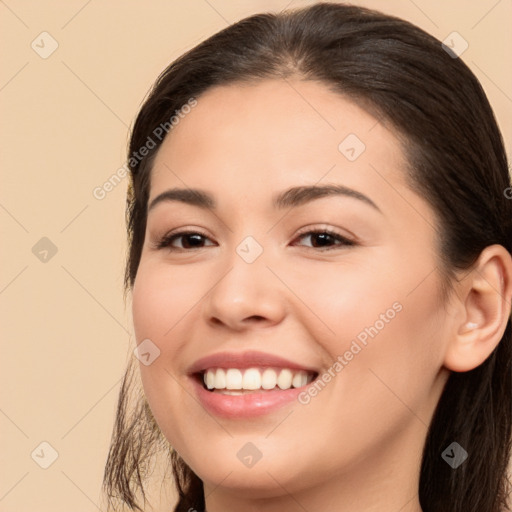 Joyful white young-adult female with long  brown hair and brown eyes