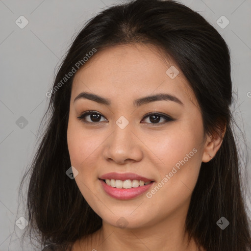 Joyful asian young-adult female with long  brown hair and brown eyes