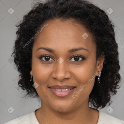 Joyful black adult female with medium  brown hair and brown eyes