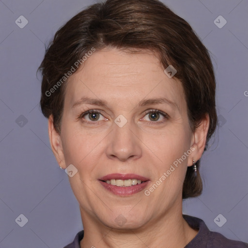 Joyful white adult female with short  brown hair and brown eyes