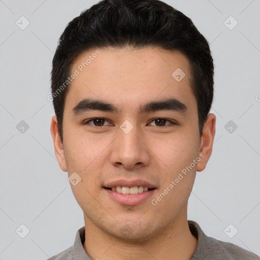 Joyful asian young-adult male with short  brown hair and brown eyes