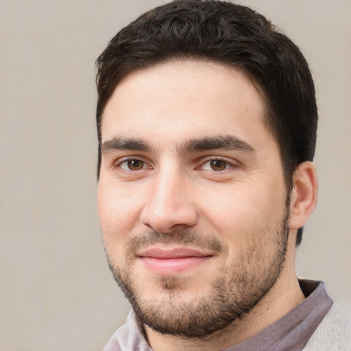 Joyful white young-adult male with short  brown hair and brown eyes