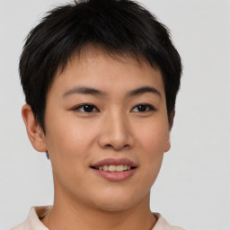 Joyful asian young-adult female with short  brown hair and brown eyes