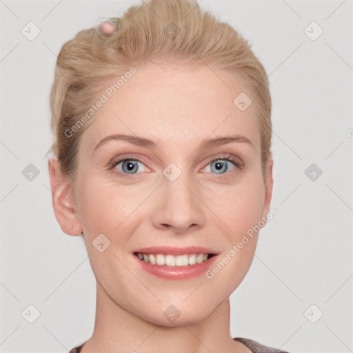 Joyful white young-adult female with short  brown hair and blue eyes