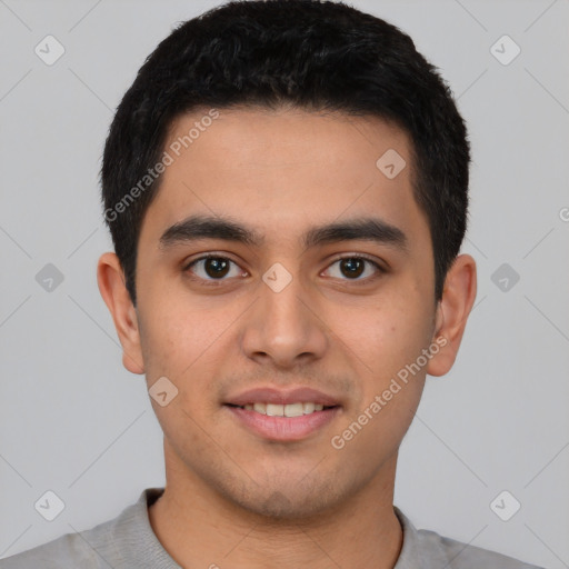 Joyful latino young-adult male with short  brown hair and brown eyes