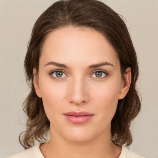 Neutral white young-adult female with medium  brown hair and brown eyes