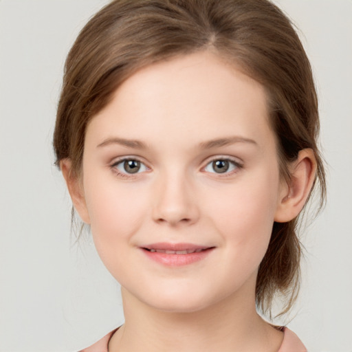 Joyful white child female with medium  brown hair and brown eyes