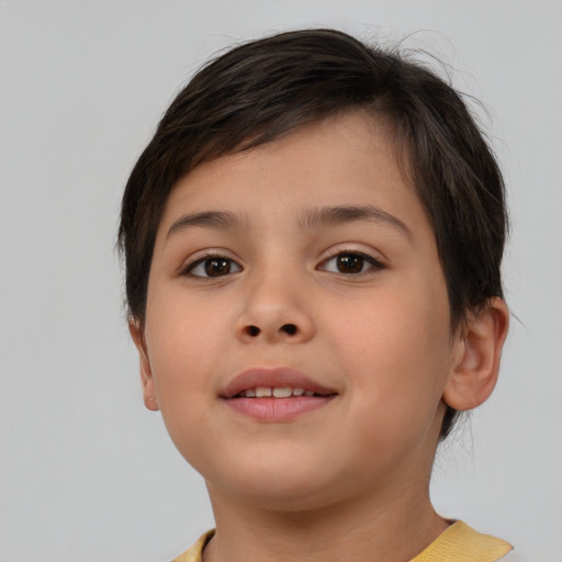 Joyful white child female with short  brown hair and brown eyes