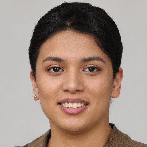Joyful asian young-adult female with short  black hair and brown eyes