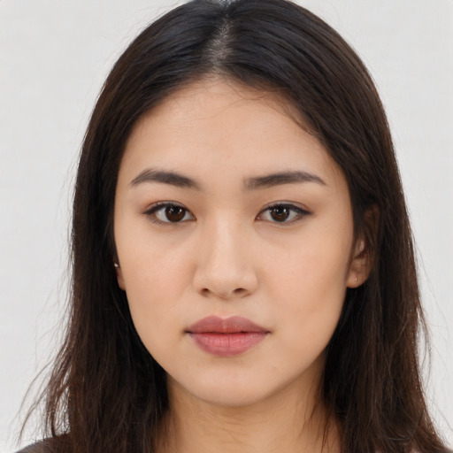 Neutral latino young-adult female with long  brown hair and brown eyes