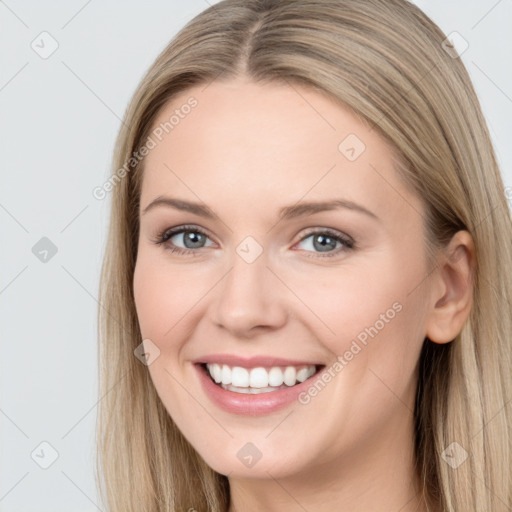 Joyful white young-adult female with long  brown hair and blue eyes