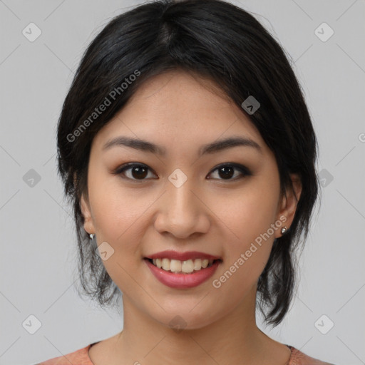 Joyful asian young-adult female with medium  black hair and brown eyes