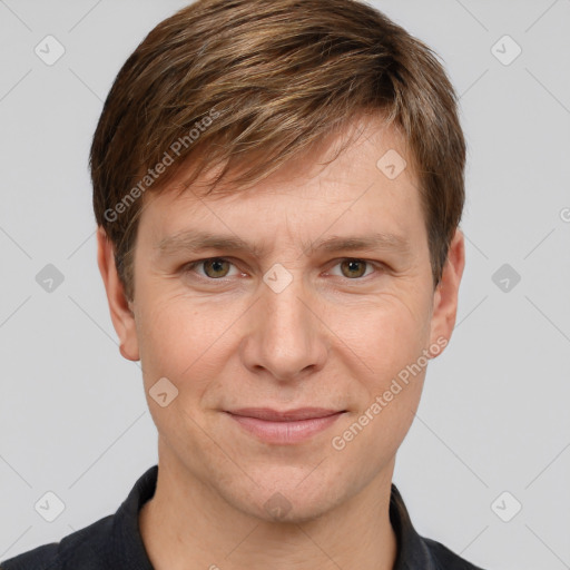 Joyful white adult male with short  brown hair and grey eyes