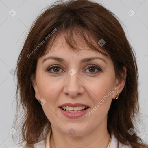 Joyful white adult female with medium  brown hair and brown eyes