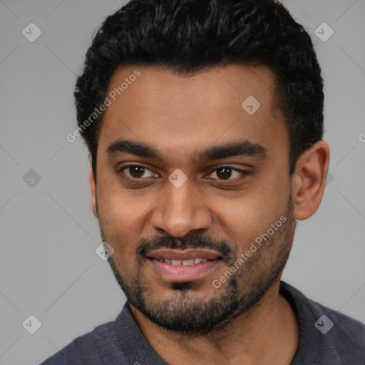 Joyful black young-adult male with short  black hair and brown eyes