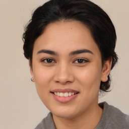 Joyful asian young-adult female with medium  brown hair and brown eyes