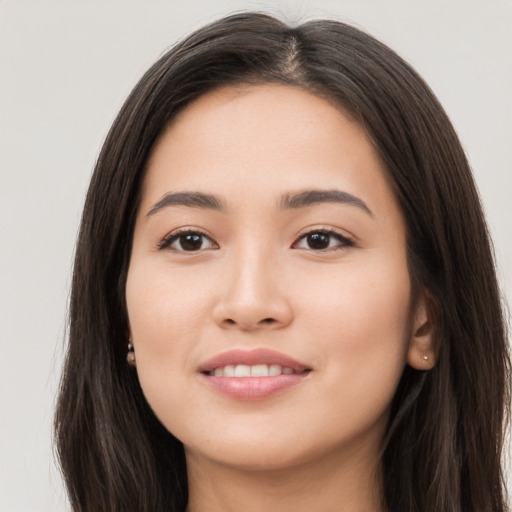 Joyful white young-adult female with long  brown hair and brown eyes