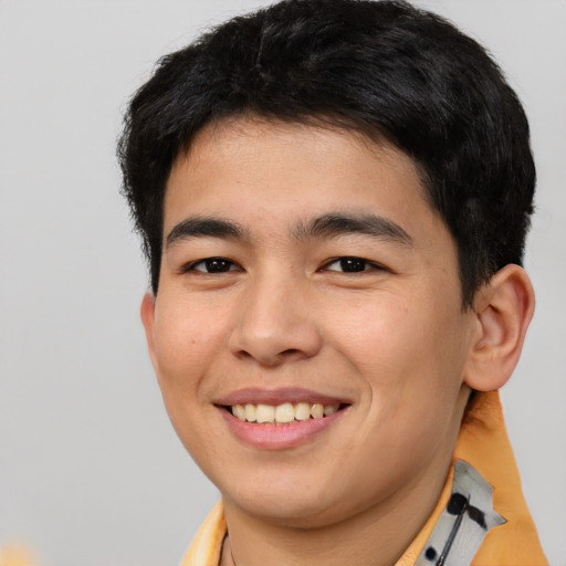 Joyful asian young-adult male with short  brown hair and brown eyes