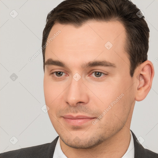 Joyful white young-adult male with short  brown hair and brown eyes