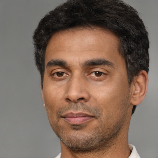 Neutral black adult male with short  black hair and brown eyes