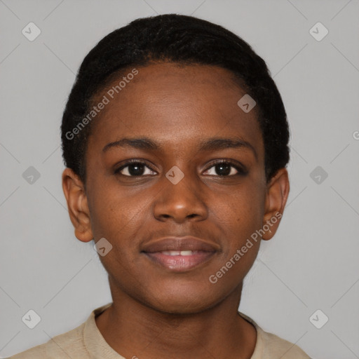 Joyful black young-adult female with short  black hair and brown eyes